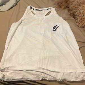 Rank top it is white it is also a little sparkly. Little longer in the front